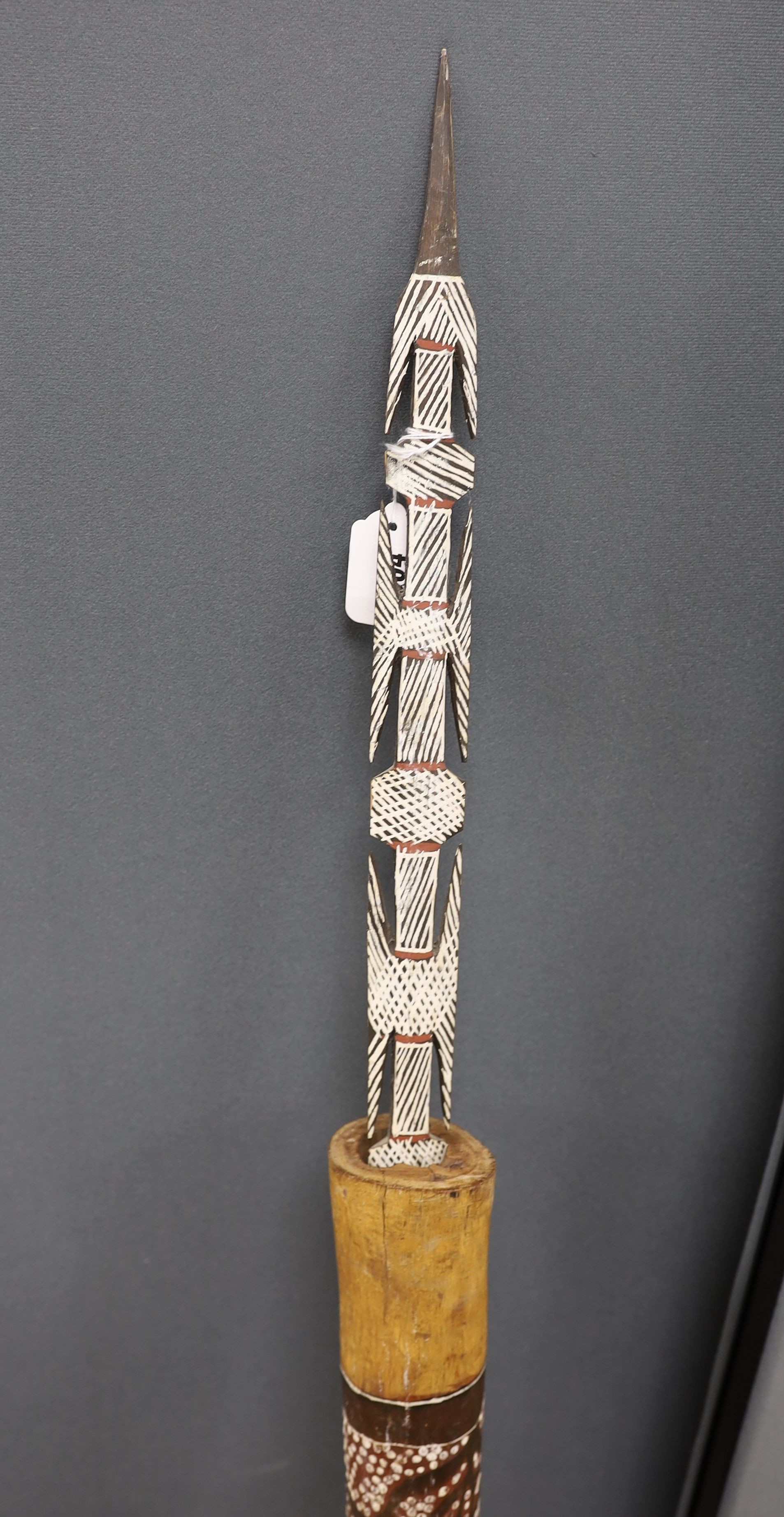 A 20th century Australian aboriginal spear and holder and 2 boomerangs., Spear 142 cms long.